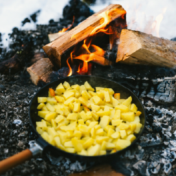 Some potatos over a fire